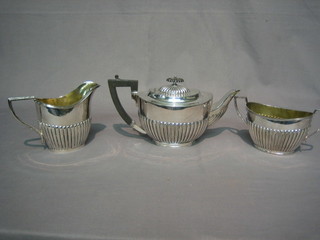 A  3 piece silver plated tea service of oval form and  demi-reeded decoration