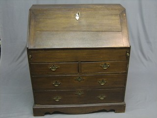 An 18th Century oak bureau with well and stepped interior above 2 short and 2 long drawers, raised on bracket feet 36"