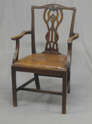 A 19th Century Chippendale style carver chair with pierced  vase splat   back  and  upholstered  seat,  raised  on   square   tapering supports with H framed stretcher