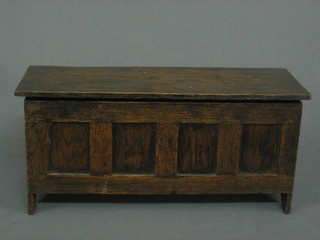 A miniature oak coffer with panel to the front and hinged lid  11"