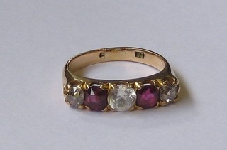A  lady's  18ct  gold  dress  ring  set  2  garnets  supported  by  3 diamonds
