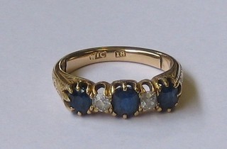 A  lady's  18ct  gold dress ring set 3  sapphires  and  2  diamonds