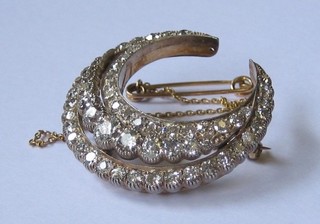 A lady's handsome 19th Century gold crescent shaped brooch  set  approx. 59 diamonds