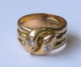 An  18ct  gold serpent ring in the form of entwined  serpents  the eyes set diamonds