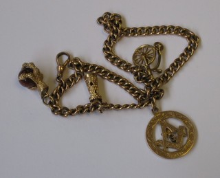 A small curb link chain hung a pierced 9ct gold Masonic  pendant and 3 other charms