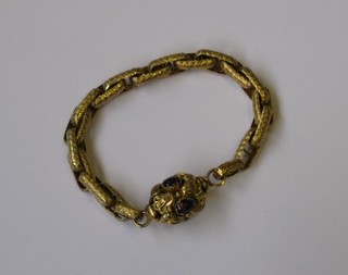 A gilt metal multi-link bracelet, the clasp set hardstones