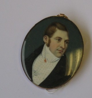 An  18th/19th  Century  oval  portrait miniature  on  ivory  of  a gentleman contained in a gold mount