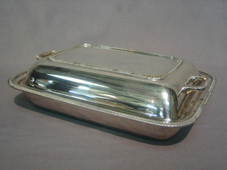 A  rectangular  silver plated twin handled entree  dish  and  cover