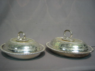 A  pair  of oval engraved silver plated entree  dishes  and  covers