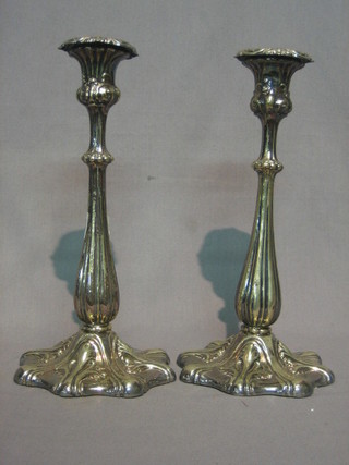 A pair of 19th Century Rococo style candlesticks with  detachable sconces 11"