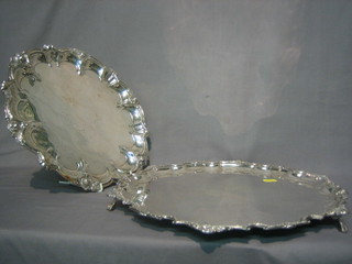 A silver plated salver with bracketed border, raised on 3 ball  and claw supports 15" and 1 other salver 12"