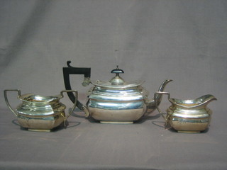 A Georgian style silver 3 piece tea service of rectangular  cushion form, comprising teapot, twin handled sugar bowl and cream jug, London 1929, 24 ozs