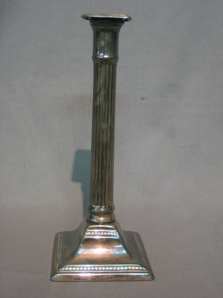 A silver plated reeded candlestick with doric capital 11"