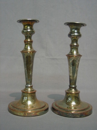 A pair of silver plated candlesticks 10 1/2"