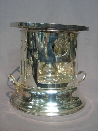 A  circular  pierced silver plated flambe  stove  manufactured  for Harrods