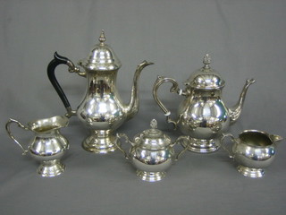A modern silver plated 5 piece tea service comprising coffee pot, tea pot, cream jug, milk jug, twin handled sugar bowl