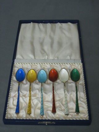 A set of 6 enamelled tea spoons, cased