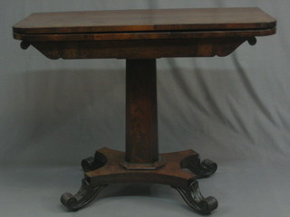 A   William  IV  D  shaped  mahogany  tea  table,  raised   on   a chamfered   column  with  triform  base  and  scrolled   feet   37"