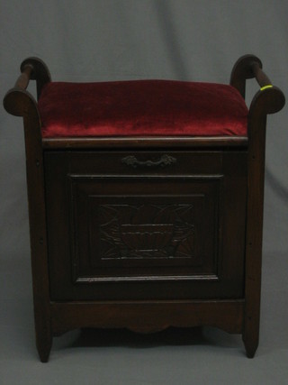 An Edwardian carved walnut box seat piano stool