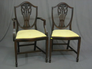 A  set  of  6  19th/20th Century  Hepplewhite  style  shield  back dining  chairs with Prince of Wales feathers and upholstered  drop in  seats, raised on square tapering supports ending in  spade  feet