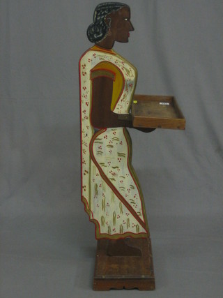 A 19th/20th Century Indian painted hardwood Blackamoor in  the form of a female bearer (hand f and r)
