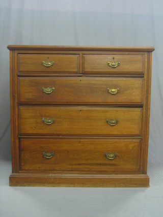 A Victorian walnut chest of 2 short and 3 long drawers with brass swan neck drop handles, raised on a platform base 48"