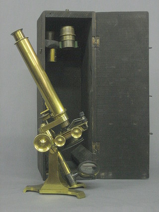 A  brass  single draw student's microscope by Newton  &  Co,  8 Fleet Street, Temple Bar London together with 3 lenses contained in a pine case