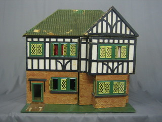 A  1930's  dolls  house in the form of a  mock  Tudor  house  24"