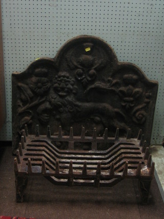 An arch shaped cast iron fire back decorated a lion 30" and a fire grate