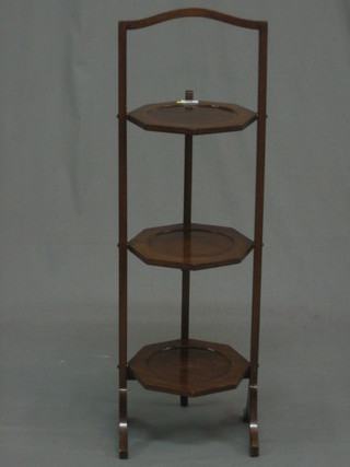 A 1930's walnut 3 tier folding cake stand