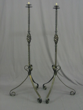 A  pair  of   blacksmith  made  wrought  iron  candle  stands  54"