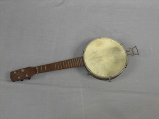 A 4 stringed banjo with 8" drum having 6 bolts to the side,  open back (no strings)