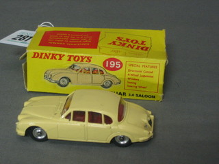 A  Dinky  Toy  195  Jaguar 3.4 saloon car,  boxed  (flap  to  box missing and writing on box)