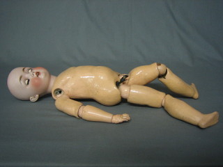 A   19th/20th  German  porcelain  headed  doll  with   open   and shutting  eyes,  open  mouth, the  head  incised  264  Catterfelder Puppenlabrik? with articulated body 23" overall