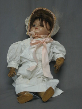 A  19th  Century carved wooden doll with  articulated  body  19"