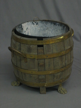 2 circular coopered buckets with brass handles and raised on  paw feet 15"