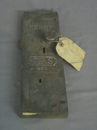 An  Etas  No. 5 brass penny in the sold lavatory  door  lock  with key,
