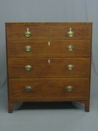 A  Georgian mahogany chest of 2 short and 3 long  drawers  with brass   plate   drop   handles,   satinwood   stringing   and    ivory  escutcheons,     raised     on    bracket     feet     40"    