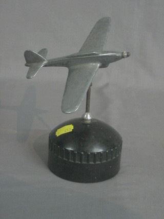 An  aluminium  model  of  a spitfire in flight  raised  on  a  black Bakelite socle base 7" 