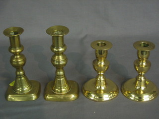 A  pair of 19th Century brass candlesticks with ejectors 7" and  a pair of brass candlesticks 5" (4)