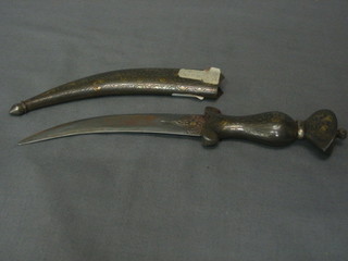 An  Amani  dagger  with 5" blade contained  in  an  inlaid  metal scabbard