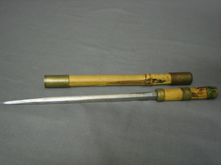A  dagger  with  8"  double edge  blade  contained  in  a  bamboo sheath (used by a dispatch rider in Burma)