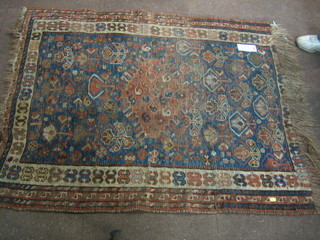A Caucasian rug with all over geometric design (some wear)  53"  x  44"