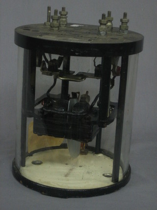 A resistor raised on a wooden calibrated base by C F Palmer  and a large glass and black Bakelite cased resistor by  Westing  House  Barker & Signal Company