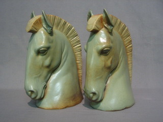 A  pair  of impressive Lladro figures of horses  heads,  the  bases incised 17E 10"