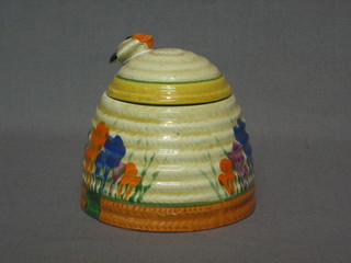 A  Clarice Cliff Crocus pattern preserve jar and cover, the  cover with bee, 4" the base marked Clarice Cliff