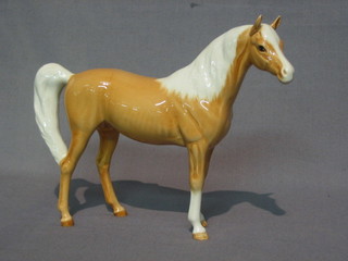 A Beswick figure of a standing Palomino horse 6"