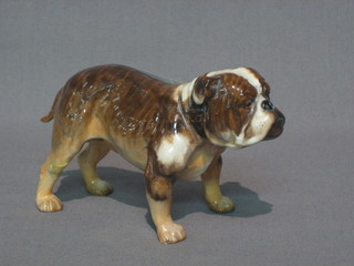 A Royal Doulton figure of a standing Bulldog, base marked 1047 (tail and back right leg f)