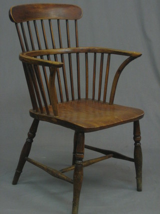 An  18th/19th  Century  elm  comb  back  carver  chair 