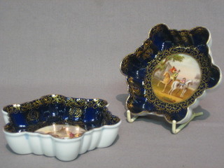 A  pair  of 19th Century Berlin black glazed  porcelain  pin  trays decorated  equestrian  scenes,  5",  the  base  with  beehive  mark